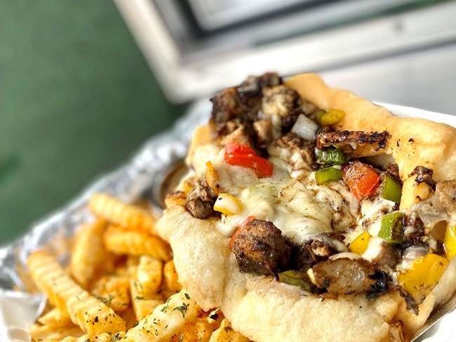 Jerk Chicken Coco Bread Philly with Fries 